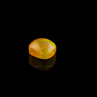 Ethiopian Opal - 1.65ct Rolling Flash Caramel Color Background