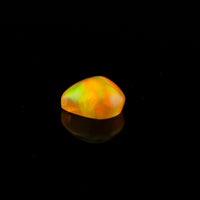 Ethiopian Opal - 1.65ct Rolling Flash Caramel Color Background